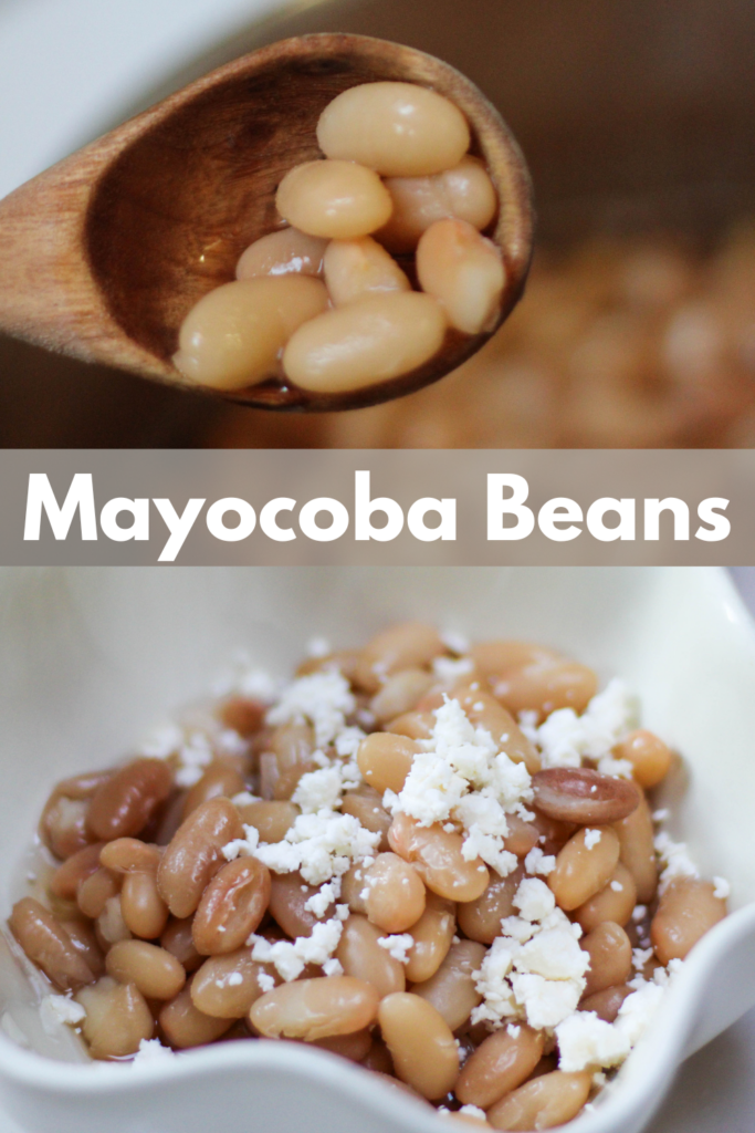 Cooked Peruvian Beans in a white bowl with cheese on top. Peruano Beans topped with crumbled cheese. Mayocoba beans with queso fresco. 