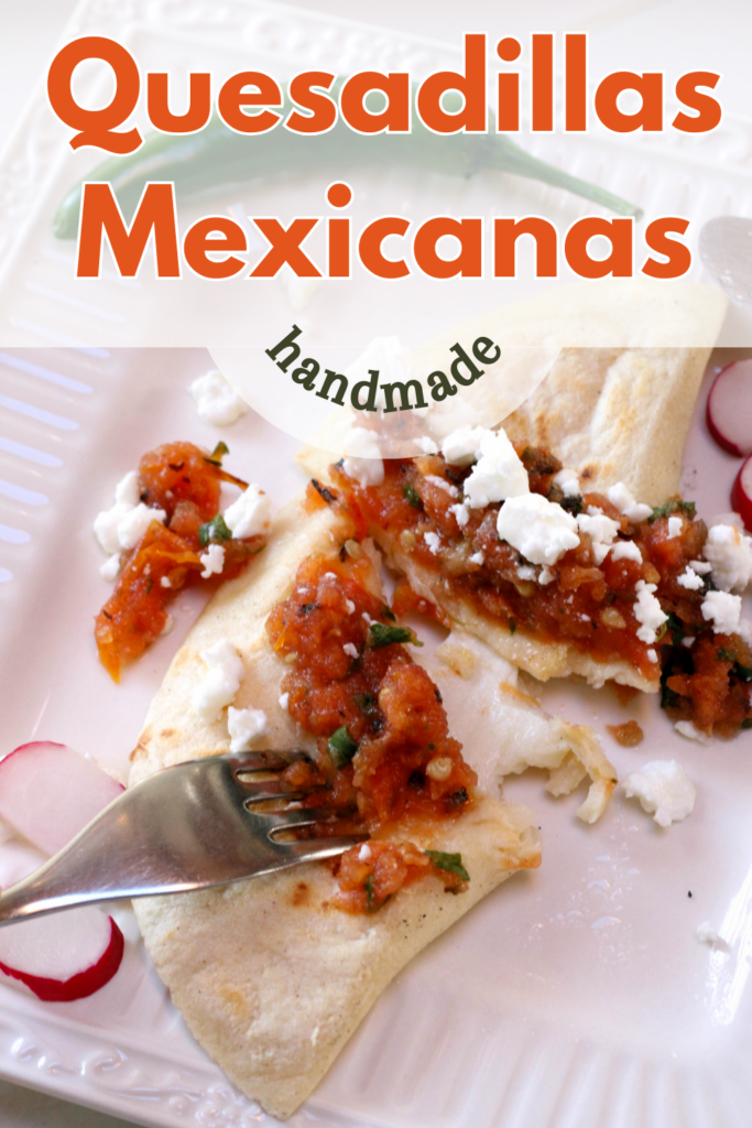 Quesadilla de Masa topped with salsa and queso fresco.