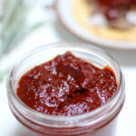 Chile guajillo salsa in a glass serving dish.