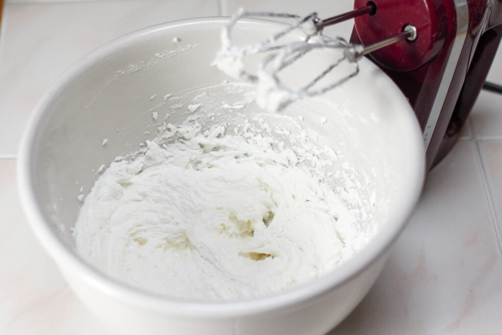 White bowl filled with whipped vegetable shortening and sugar.
