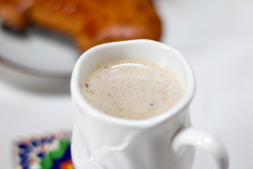 atole de avena in a white mug
