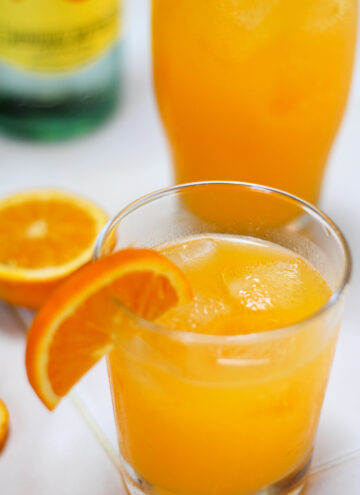 Glasses of naranjada mineral with a white background